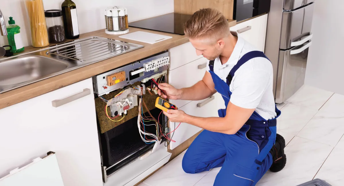 Expert technician repairing dishwasher fixing a home dishwasher