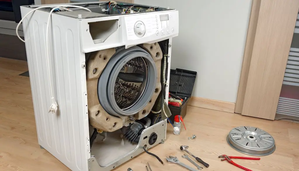 Broken washing machine showing common appliance issue in washer repair service
