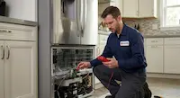 Professional technician from Appliance Repair Salem Pro diagnosing a refrigerator's electrical components using a multimeter in a modern kitchen.