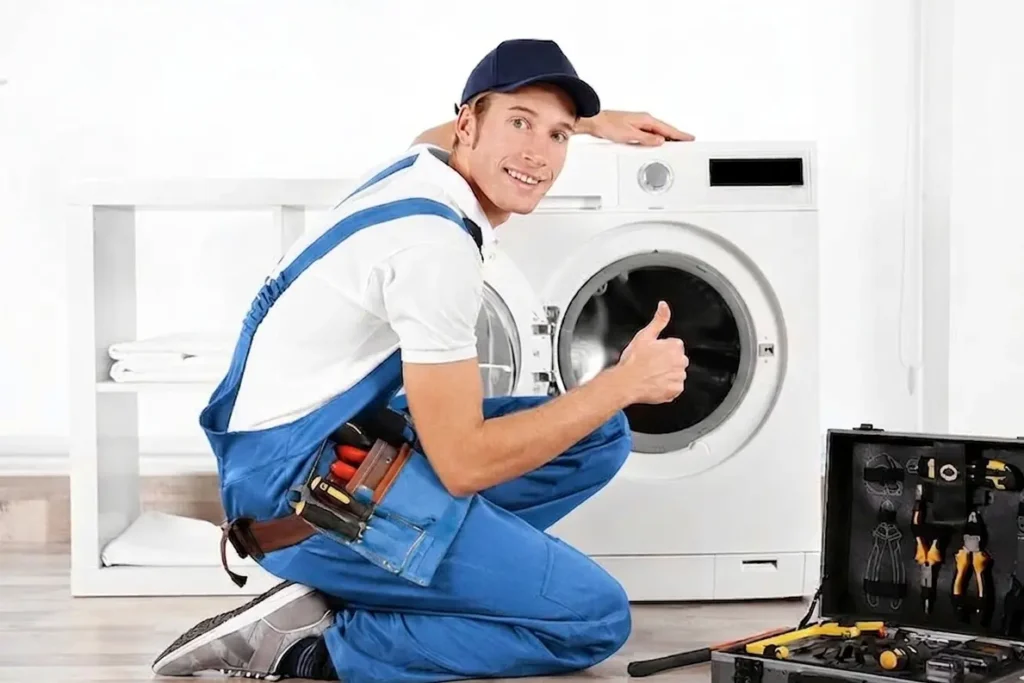 Experienced washer repair technician giving thumbs up after successful washing machine repair in Salem Oregon